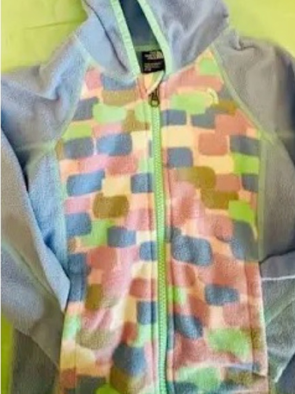 North Face Glacier fleece jacket, light blue and colorful, geometric panel.